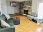 Upstairs 4 Season`s Room takes in great lake views from the hight top glass fire pit and wall TV